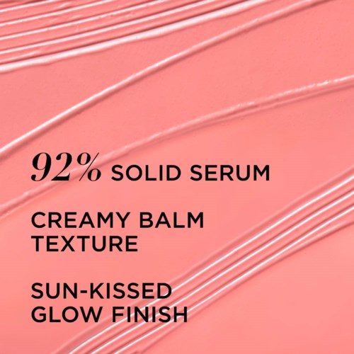A pink background with black text describing a skincare product: 92% solid serum, creamy balm texture, sun-kissed glow finish.