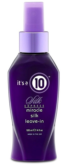 En liten lila sprayflaska märkt 'miracle silk leave-in' hårvårdsprodukt, tillverkad i USA.