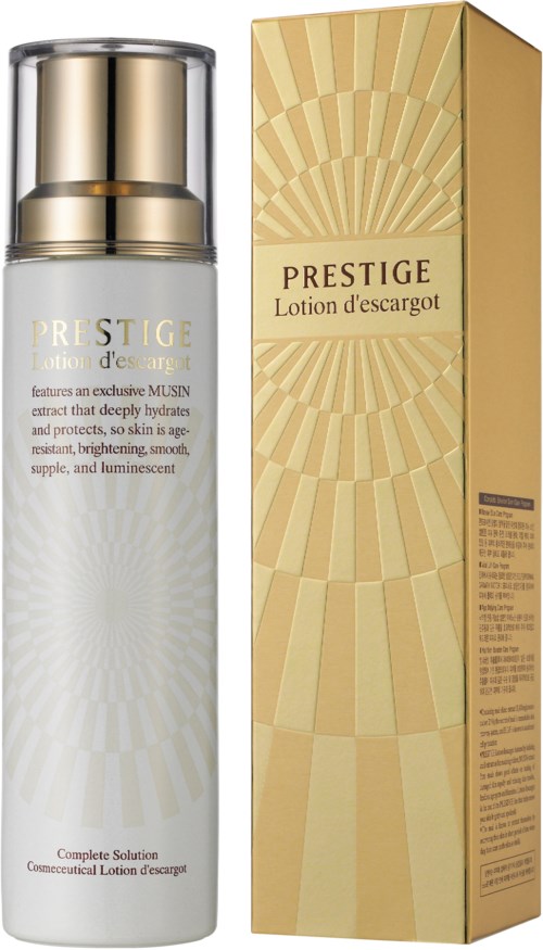 Ett hudvårdsprodukt som heter Prestige Lotion d'escargot, med vit flaska och guldförpackning, avsett för återfuktning och ljusare hud.