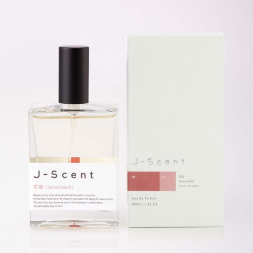 Ein klarer Glasparfümflasche mit schwarzem Deckel und weißer Verpackungsbox mit J-scent Hanamachi Duft.
