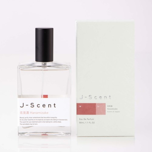 Glassparfümflasche mit schwarzem Deckel neben einer weißen Box mit J-scent und Hanasakiake Scent of Jeanne.