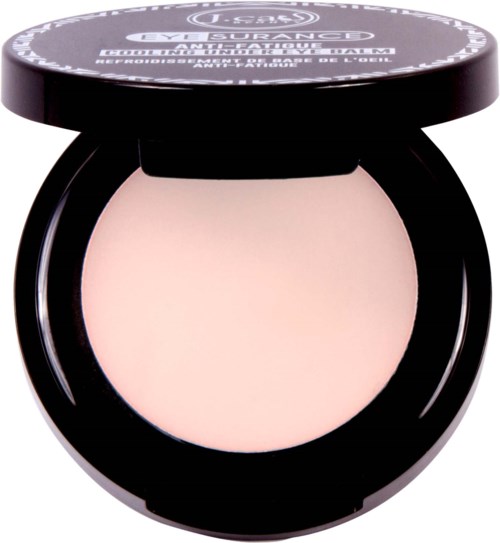 En kompakt med presset puddermakeup med svart lokk, merket 'Urban Decay'.