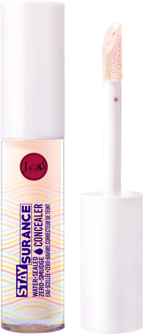 En tydlig flaska med Stayy Assurance vattnedsbaserad concealer med vit kork och applicator.