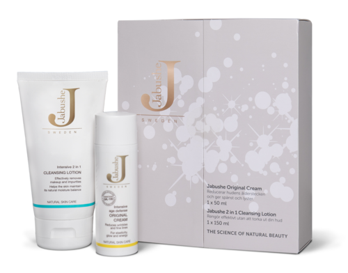 Hudvårdsset med kräm, lotion och box märkt Jabushe Original, utformat för hudvård. Enkelt och rent förpackning.