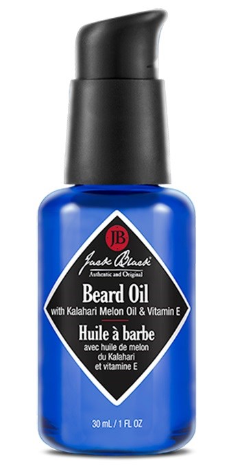 En blå flaske med bartolje med en svart pumpe, etiketten viser at den inneholder melon og vitamin E, 30 ml.