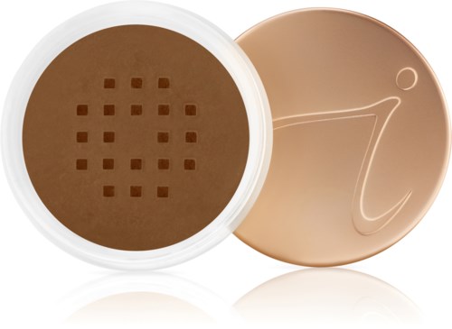 En rund behållare med brunt puder och ett lock med en enkel 'i'-symbol.