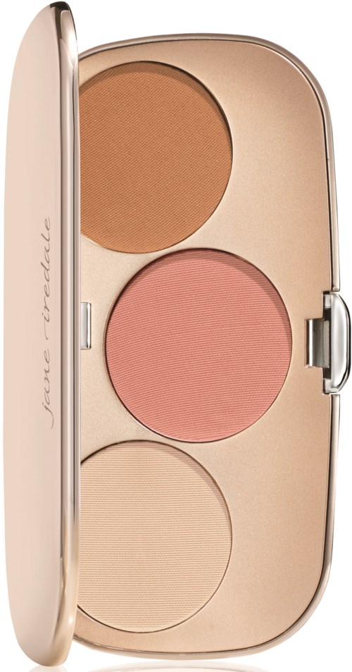 En liten öppen förpackning med tre olika färgade puder, i beige och persikofärger, med lock som glider.