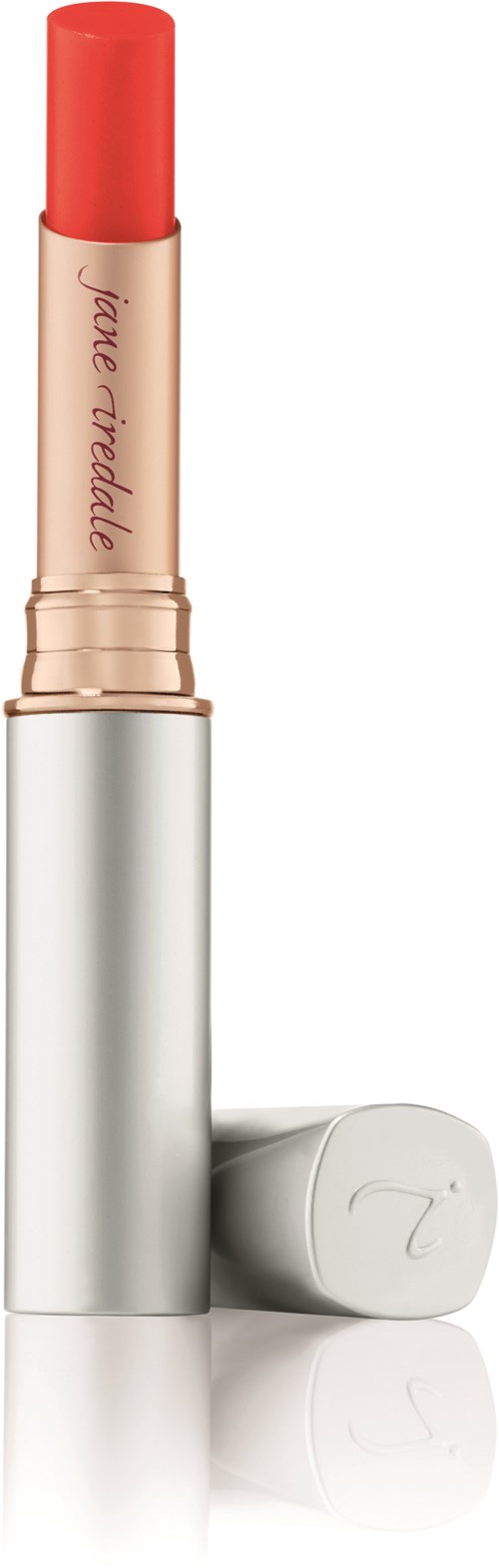 A pink lipstick with a silver and white case, standing upright with the cap off to show the lipstick.