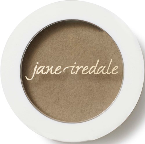 Varumärket 'jane iredale' skrivet på en rund produktbehållare, troligen makeup eller hudvård.