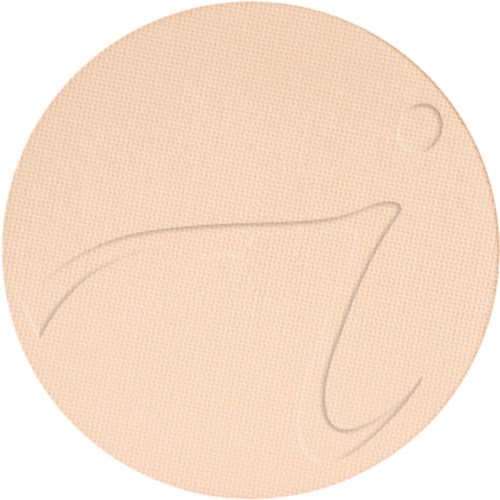 Ett beige runt ansiktsmakeup-kompakt med en enkel kurvadesign upptill.