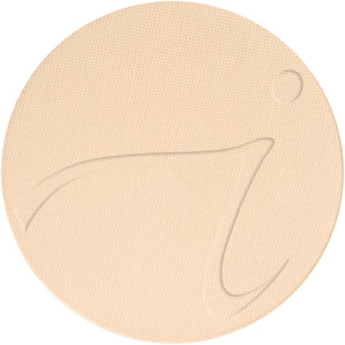 En beigefärgad, texturerad rund yta med svaga, kurviga linjer och en liten cirkel.