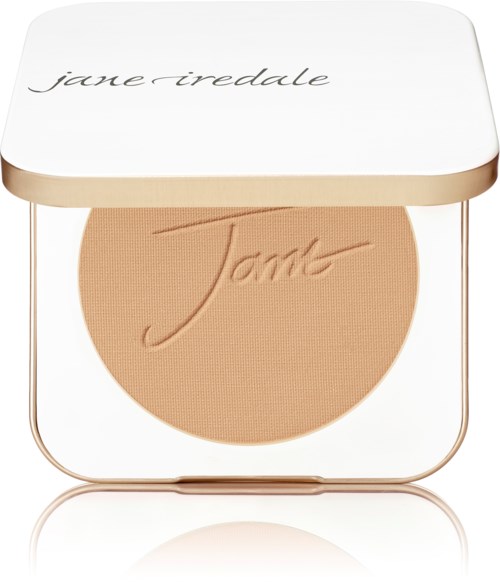 En kompakt puder med ordet 'Jamb' inpräglat, i en vit och guldig kapsel, med 'jane iredale' på locket.