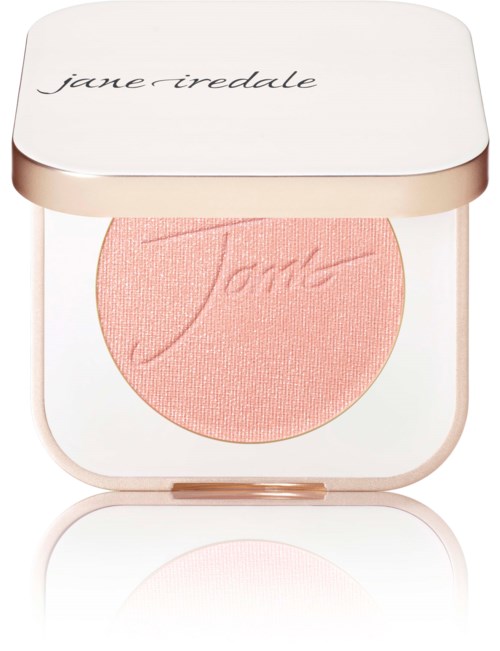 A pink blush in a round compact with a white lid, labeled 'jane iredale'.
