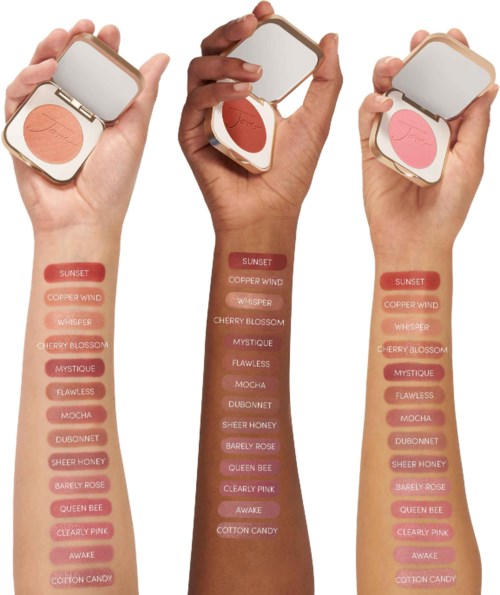Three hands hold compact makeup products with various shades, each with a list of names beside in pink tones.