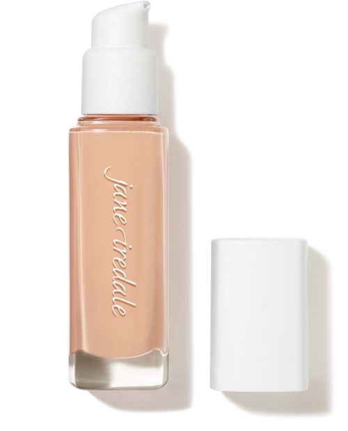 A beige liquid foundation bottle with a white cap and a white pump, labeled 'Jill de Ride' on the front.