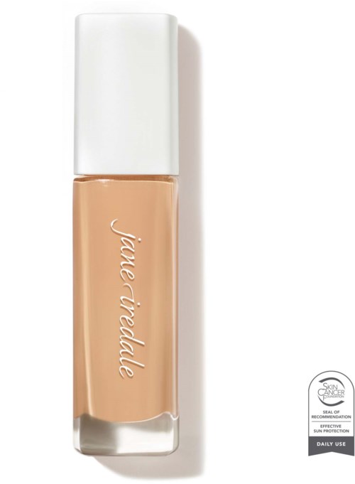 A bottle of beige liquid concealer with a white cap and brand name on the front.