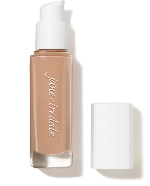 A beige liquid foundation in a clear bottle with a white cap and a pump dispenser.