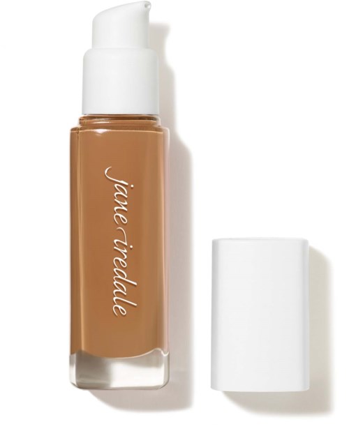 A makeup bottle labeled "jane iridelle" with a white cap, contains foundation or liquid makeup.