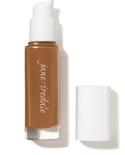A brown liquid foundation bottle with a white pump and a white cap beside it. The bottle has the label "Jia Ri Udalle."