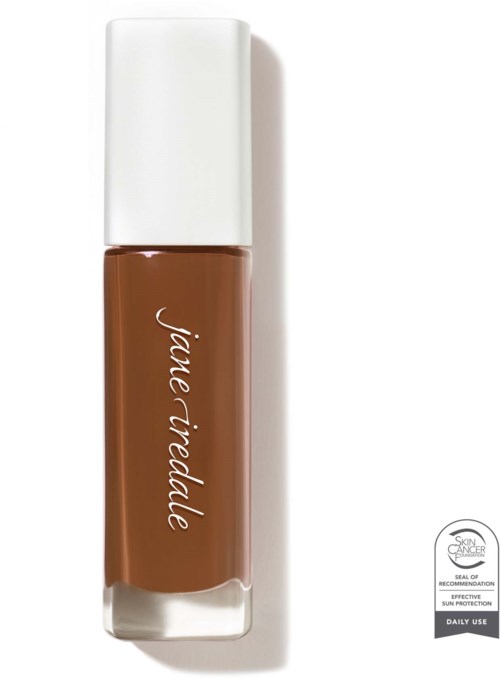 A brown lipstick in a clear tube with a white cap and brand name written on it. It has a skin saver logo.