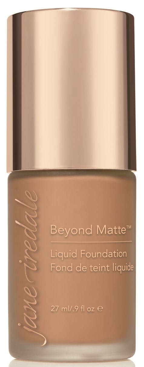 En beige flytande foundationflaska med en glänsande metallkapsel, märkt 'Beyond Matte' av Jane Iredale.