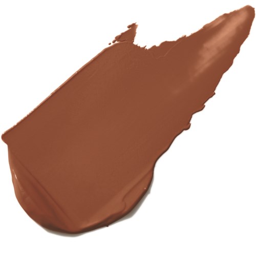 En fläck av choklads spread med spetsig ände och slät yta.