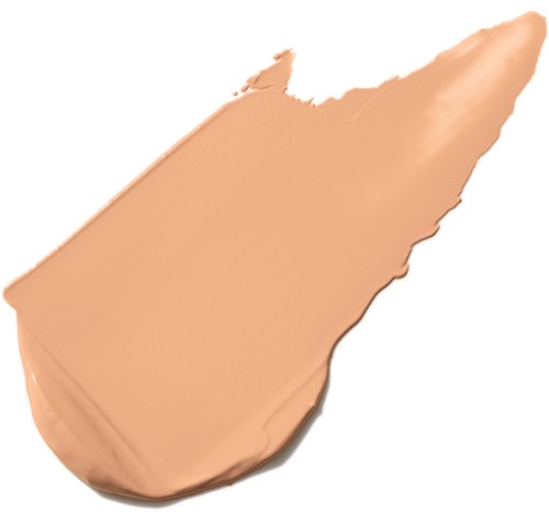 En klump av beige-färgad makeupprodukt i en skedform.