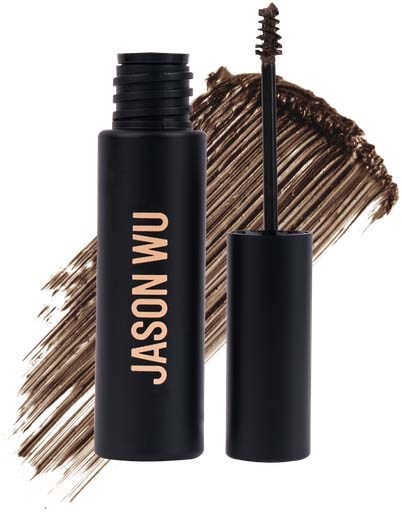Een zwarte mascara-flacon met de naam Jason Wu, met borsteldraad zichtbaar, op een bruine penseelstreep-achtergrond.