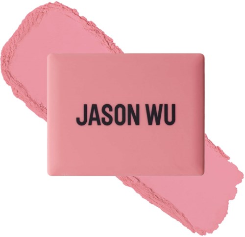 Pinkki savon, jossa lukee 'JASON WU', aseteltu pinkin meikin tai maalin päälle.