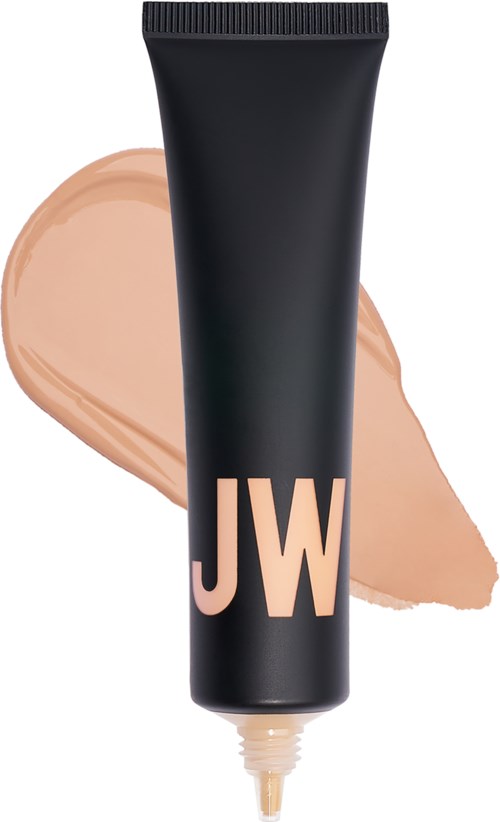 Svart tub med 'JW' logo och beige flytande makeup bredvid.