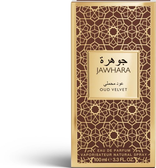 Złota i brązowa butelka perfum z arabeskowymi wzorami, oznaczona Jawhara Oud Velvet. Zawiera 100 ml Eau de Parfum.