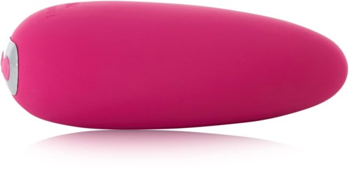 Een roze voorwerp dat glad en afgerond lijkt, met een kleine witte en roze knop aan de zijkant.