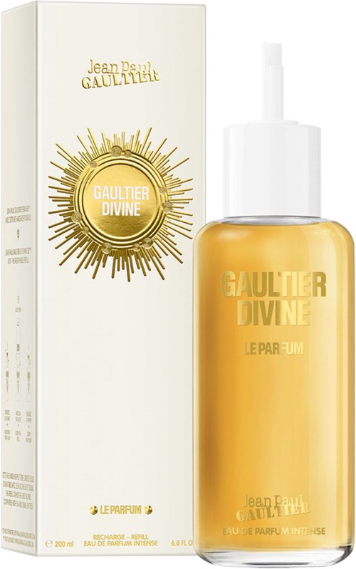 En parfymeflaske med en hvit og gullfarget eske bak, merket Gaultier Divine.