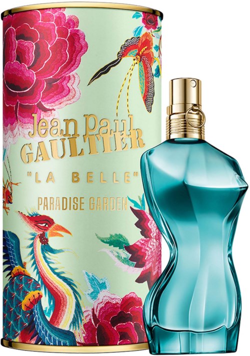Ein Parfümflasche mit blau gewelltem Design und goldener Kap Kann-Schraube, daneben eine bunte Box mit Blumen und Vögeln.