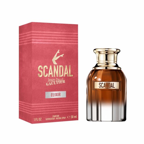 Hajuvesipullo nimeltä 'Scandal Elixir' ja sen pinkin laatikon vieressä. Pullo on ruskea ja siinä on kiiltävä kultainen korkki.