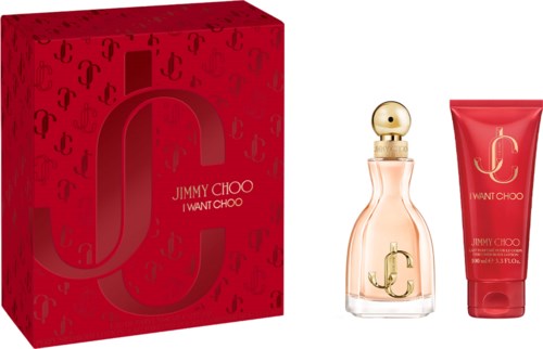Jimmy Choo I Want Choo parfymflaska och matchande bodylotion framför en röd box med logotypmönster.
