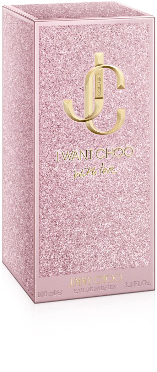 Różowe błyszczące pudełko z złotym logo i tekstem na perfumy 'I WANT CHOO'.