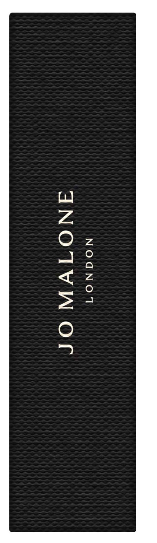 Black textured object with white text that reads "JO MALONE LONDON" in the center.