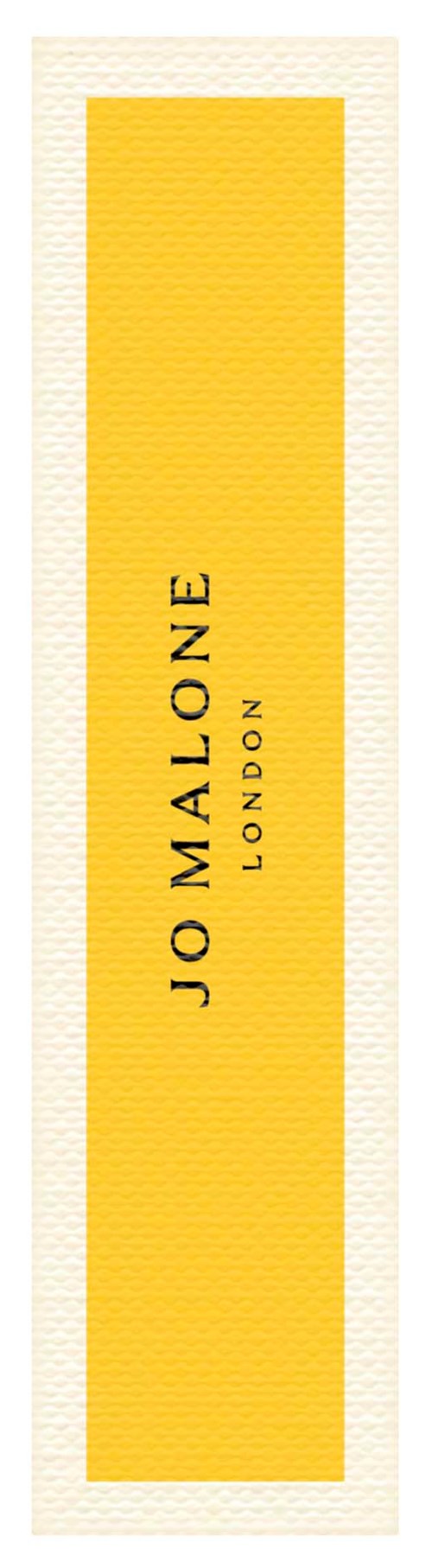 A tall yellow rectangular label with black text saying 'Jo Malone London.'
