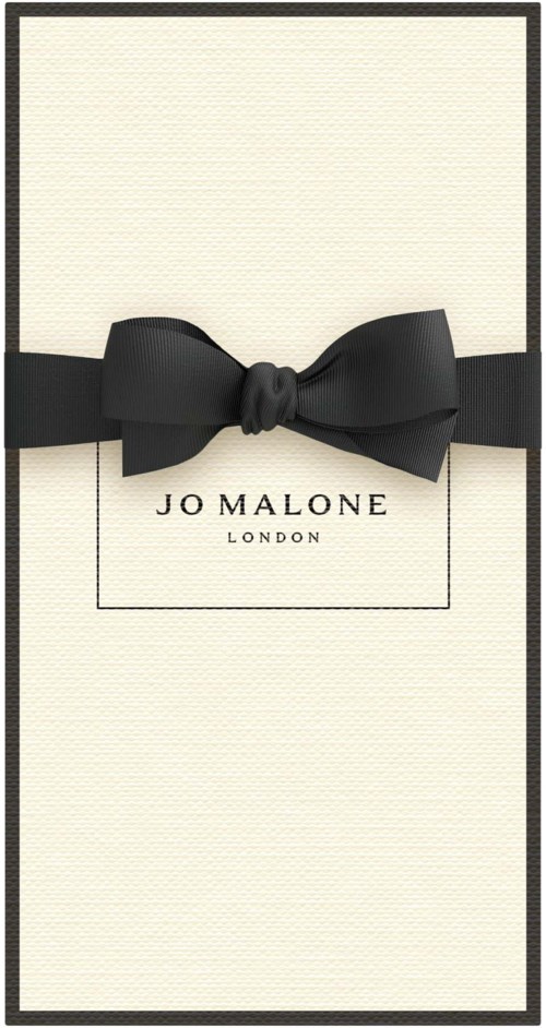 Elegant white box with a black bow, labeled 'JO MALONE LONDON', presents luxury gift packaging.