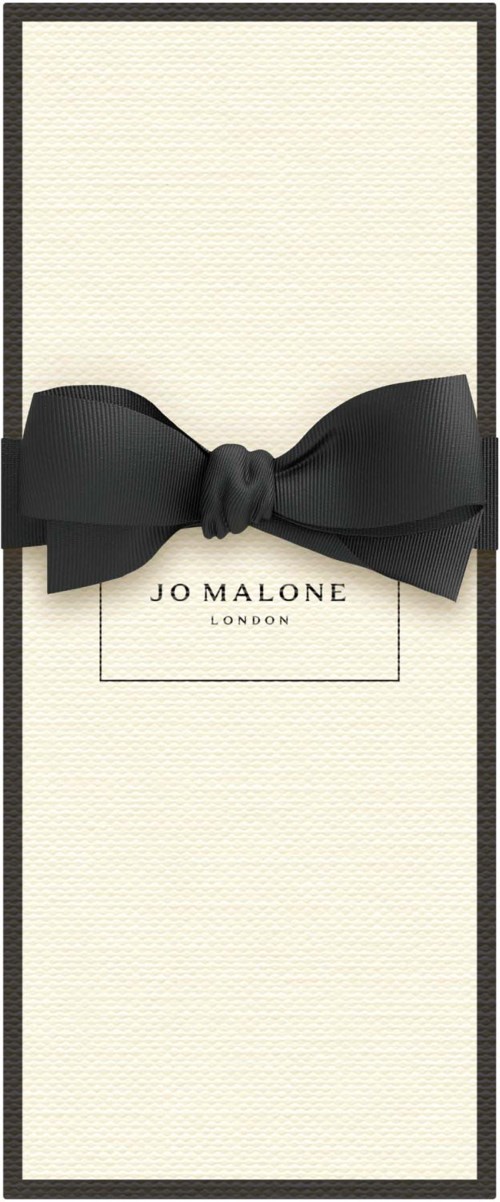 A Jo Malone gift box with a large black bow and text "JO MALONE LONDON" in the center.