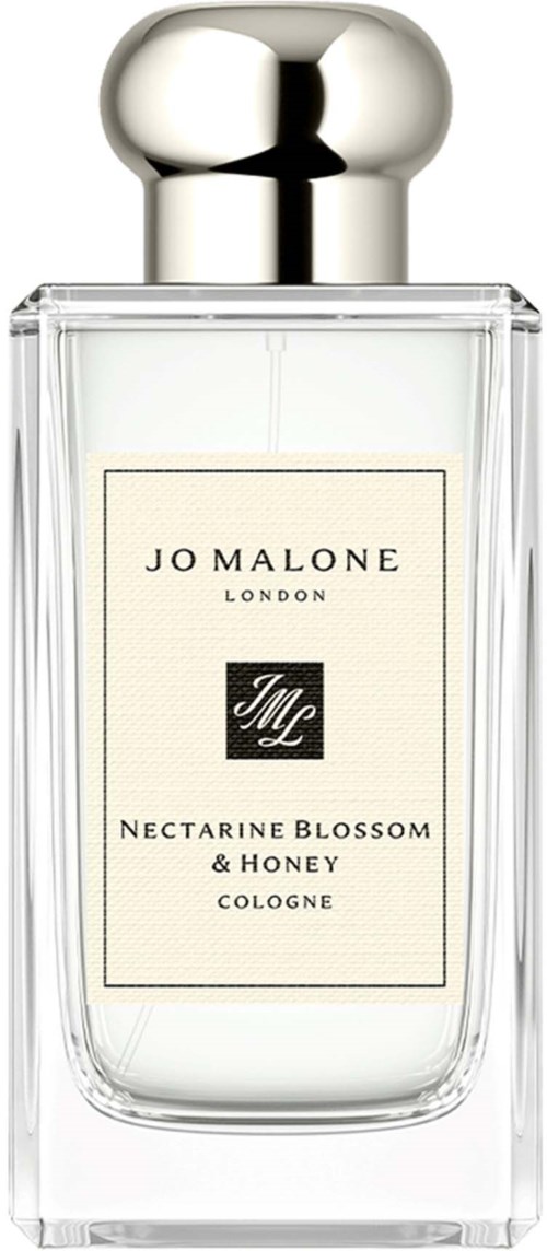 A clear glass bottle with a silver cap, labeled Jo Malone, Nectarine Blossom & Honey Cologne.