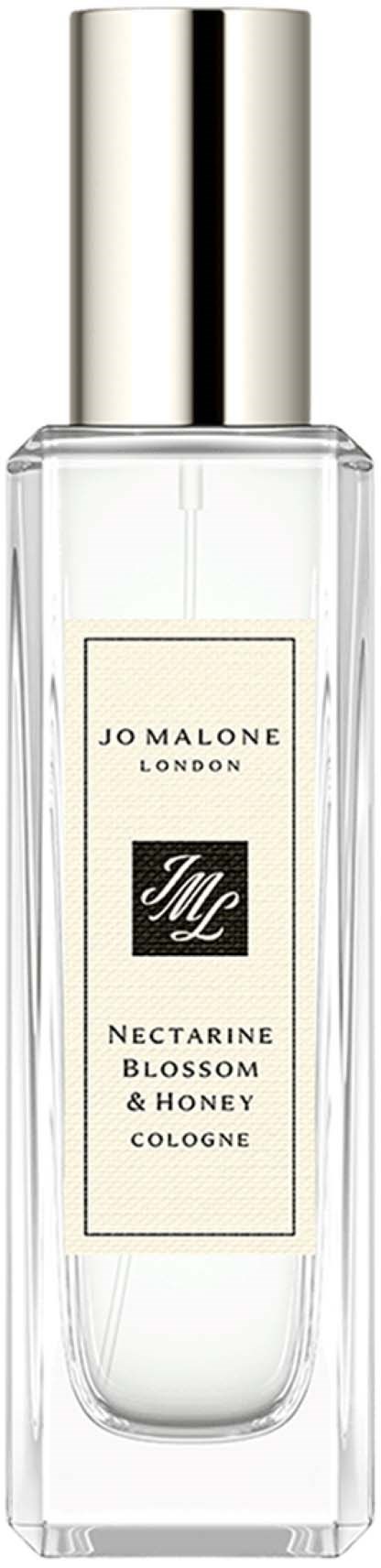 En klar glasflaska med silverlock, märkt 'Jo Malone London' och 'Nectarine Blossom & Honey Cologne.'