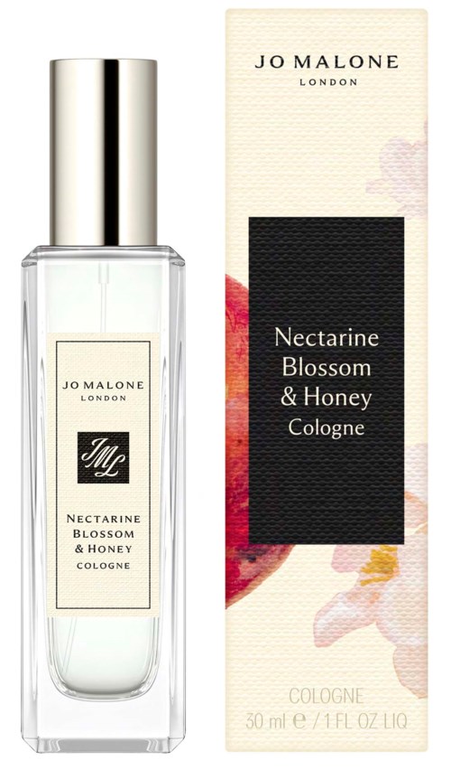A clear perfume bottle with a silver cap and a box featuring flowers and the scent name Nectarine Blossom & Honey.