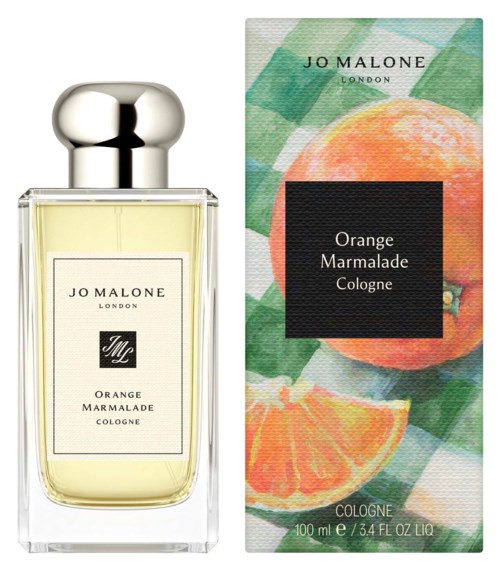A perfume bottle and box for Jo Malone Orange Marmalade Cologne, featuring bright orange and green fruit illustrations.