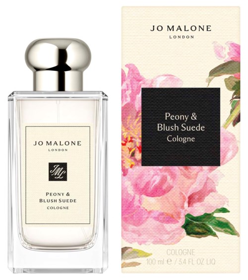 A perfume bottle with a silver cap and a floral box label containing pink flowers and green leaves.