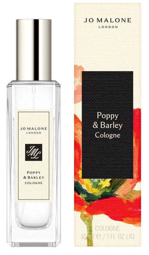 A clear perfume bottle with a silver cap, next to a box with colorful flower artwork and black label.