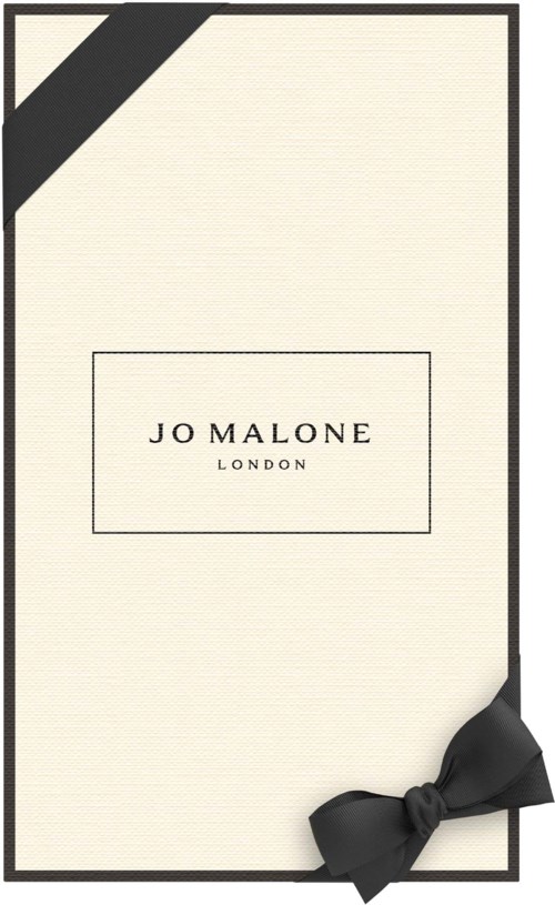 Elegant krämfärgat anteckningsblock med svart band och svart hörn, med minimalistisk etikett "Jo Malone London."