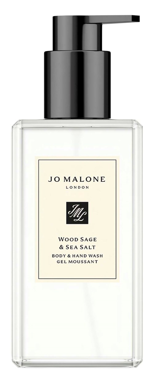 A clear plastic bottle with a black pump containing Jo Malone London Wood Sage & Sea Salt body and hand wash.