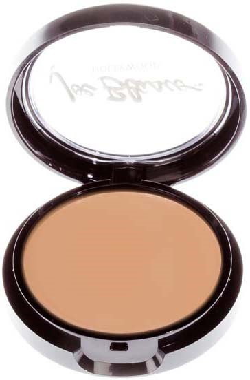 A compact with beige powder inside and a mirror on the lid, open for use.